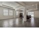 Open living space with tray ceiling and view of the sliding glass doors at 3624 Autumn Amber Dr, Spring Hill, FL 34609