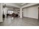 Open-concept living space boasts tile flooring, recessed lighting, and seamless flow at 3624 Autumn Amber Dr, Spring Hill, FL 34609