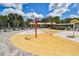 Community splash pad with colorful water features, seating areas, and sunshades for Gathering enjoyment at 3624 Autumn Amber Dr, Spring Hill, FL 34609