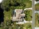 Aerial view of backyard pool, lanai, and beautiful landscaping at 4110 Highland Park Cir, Lutz, FL 33558
