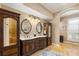 Luxurious bathroom with double vanities, tile floor, and elegant fixtures at 4110 Highland Park Cir, Lutz, FL 33558