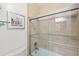 Bathroom with decorative tile in the shower and glass shower door at 4110 Highland Park Cir, Lutz, FL 33558