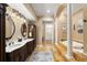 Luxurious bathroom with double vanities, garden tub, and elegant fixtures at 4110 Highland Park Cir, Lutz, FL 33558