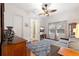 Bedroom with neutral walls, wood floors, ensuite bathroom, and large windows at 4110 Highland Park Cir, Lutz, FL 33558