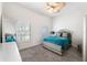 Bright bedroom with plush carpet, ceiling fan, and mirrored accents at 4110 Highland Park Cir, Lutz, FL 33558