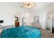 Bright bedroom with a ceiling fan, adjacent bathroom, and neutral colored carpet at 4110 Highland Park Cir, Lutz, FL 33558