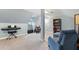Finished bonus room featuring neutral carpet, comfortable seating, a piano, and a built-in bookshelf at 4110 Highland Park Cir, Lutz, FL 33558