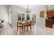 Dining area with natural light, chandelier, and views of the outdoor area at 4110 Highland Park Cir, Lutz, FL 33558