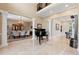 Elegant foyer with a grand piano, dining area, and marble floors at 4110 Highland Park Cir, Lutz, FL 33558