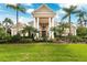 Luxurious home exterior with manicured lawn, palm trees, and a grand entrance with white pillars at 4110 Highland Park Cir, Lutz, FL 33558