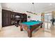 Spacious game room featuring a pool table, bar area, and elegant decor at 4110 Highland Park Cir, Lutz, FL 33558