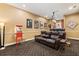 Basement home theater with tiered leather seating, a projector screen, and a vintage popcorn maker at 4110 Highland Park Cir, Lutz, FL 33558