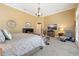 Relaxing main bedroom featuring a fireplace, a TV, and a comfortable sitting area at 4110 Highland Park Cir, Lutz, FL 33558