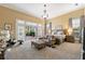 Serene main bedroom with a sitting area, French doors, and plenty of natural light at 4110 Highland Park Cir, Lutz, FL 33558