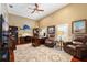 Large office space with custom built-ins, hardwood floors, and ample natural light at 4110 Highland Park Cir, Lutz, FL 33558