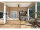 Outdoor kitchen and bar area with seating on a screened lanai, perfect for entertaining at 4110 Highland Park Cir, Lutz, FL 33558