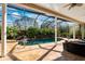 Luxurious outdoor pool with a waterfall and screened enclosure, perfect for relaxation and entertainment at 4110 Highland Park Cir, Lutz, FL 33558