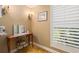 Charming vanity area with decorative mirror, sconces, and plantation shutters at 4110 Highland Park Cir, Lutz, FL 33558