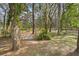 Fenced backyard featuring mature trees and partial shade at 6524 Coronet Dr, New Port Richey, FL 34655