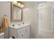 Bathroom featuring a vanity with a framed mirror, exuding clean lines and a welcoming space at 6524 Coronet Dr, New Port Richey, FL 34655