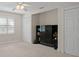 Well-lit bedroom with closet space, and neutral walls, and carpet flooring at 6524 Coronet Dr, New Port Richey, FL 34655