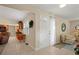 Inviting foyer area with tile floors and neutral decor, complemented by a comfortable seating area at 6524 Coronet Dr, New Port Richey, FL 34655