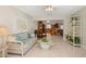 Inviting living area with access to the kitchen, natural light, and tile floors, connecting living spaces at 6524 Coronet Dr, New Port Richey, FL 34655