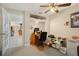 Bright home office space featuring carpeting, natural light, and built-in shelving with a desk at 6524 Coronet Dr, New Port Richey, FL 34655