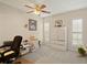 Bright office space featuring neutral walls, carpet flooring, and plantation shutters at 6524 Coronet Dr, New Port Richey, FL 34655