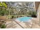 Relaxing screened-in pool area, a perfect outdoor oasis at 6524 Coronet Dr, New Port Richey, FL 34655