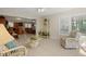 Bright sunroom boasting tiled floors, comfortable seating, and charming decor at 6524 Coronet Dr, New Port Richey, FL 34655