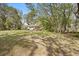 This home features a spacious yard with an outbuilding and attached garage at 6524 Coronet Dr, New Port Richey, FL 34655