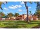 Manicured backyard featuring a sprawling lawn and a charming patio, ideal for relaxation and recreation at 6935 Date Palm S Ave, St Petersburg, FL 33707