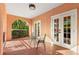 Charming balcony with wrought iron furniture and a view of lush greenery at 6935 Date Palm S Ave, St Petersburg, FL 33707