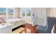 Bright bedroom with wood floors, a quaint bed, area rug and comfortable accent chair at 6935 Date Palm S Ave, St Petersburg, FL 33707