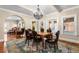 Elegant dining room featuring a decorative chandelier, hardwood floors, and seating for six at 6935 Date Palm S Ave, St Petersburg, FL 33707