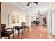 Open foyer area with terracotta tile, chess table, grand piano, and arched windows providing ample natural light at 6935 Date Palm S Ave, St Petersburg, FL 33707