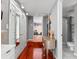 Hallway featuring a vanity, closet, and access to another room with a closet at 6935 Date Palm S Ave, St Petersburg, FL 33707