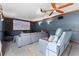 Home theater with reclining chairs, projector screen, and custom trim; perfect for movie nights at 6935 Date Palm S Ave, St Petersburg, FL 33707