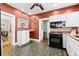 Kitchen showcasing ample cabinet space, modern appliances, and a unique tile floor at 6935 Date Palm S Ave, St Petersburg, FL 33707