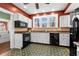 Bright kitchen with modern appliances, ample cabinet space, and a functional layout at 6935 Date Palm S Ave, St Petersburg, FL 33707