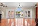 Bright living room with french doors overlooking the pool area providing seamless indoor/outdoor living at 6935 Date Palm S Ave, St Petersburg, FL 33707