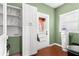 Mud room with storage cabinets, window, and access to backyard at 6935 Date Palm S Ave, St Petersburg, FL 33707
