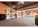 Inviting outdoor patio with a swimming pool, ceiling fans, and brick pavers at 6935 Date Palm S Ave, St Petersburg, FL 33707