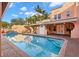 Gorgeous pool reflecting the peachy exterior of this Mediterranean home surrounded by palm trees at 6935 Date Palm S Ave, St Petersburg, FL 33707