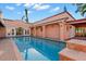 Backyard pool oasis features beautiful tiling and a covered deck, perfect for outdoor enjoyment at 6935 Date Palm S Ave, St Petersburg, FL 33707