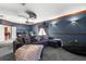Spacious entertainment room with a large sectional sofa and home theater projector at 6935 Date Palm S Ave, St Petersburg, FL 33707