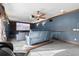 Home theater featuring comfortable reclining seating, a large screen, and cozy ambiance for entertainment at 6935 Date Palm S Ave, St Petersburg, FL 33707