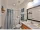 Bathroom showcasing a walk-in tub, neutral walls, and vanity with sink at 7325 S Trask St, Tampa, FL 33616