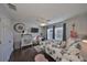 Bright bedroom with dark floors, dresser, mounted TV, and fun wall decorations at 7325 S Trask St, Tampa, FL 33616